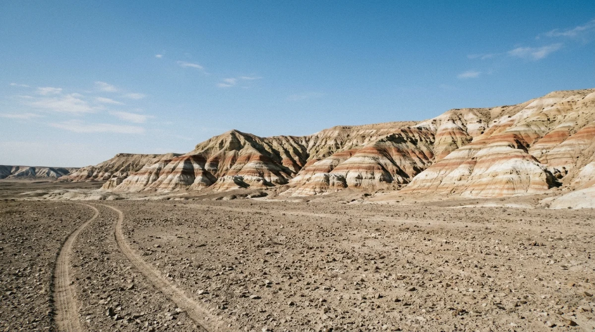 Red and white striped layers of the Kyzylkup Tiramisu hills seen on a multi-day Mangystau tour from Aktau